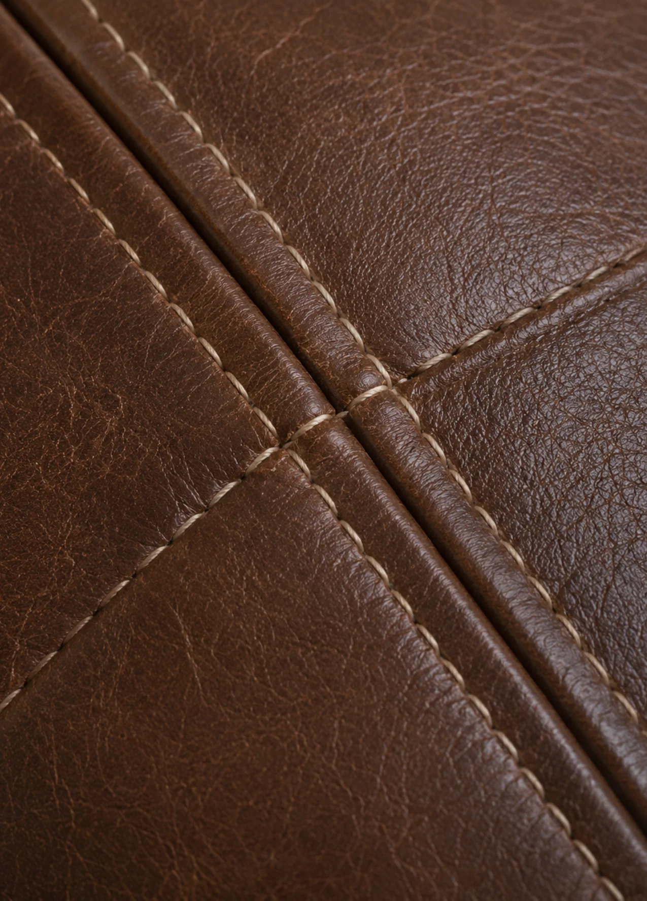 Restaurant booth leather after commercial tear repair