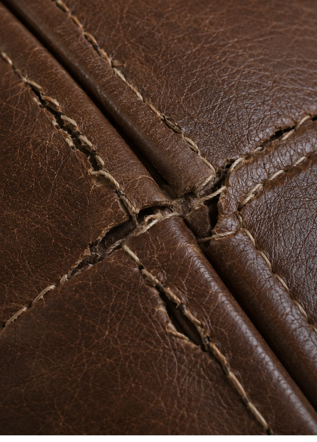 Executive chair leather with open seam and broken stitching