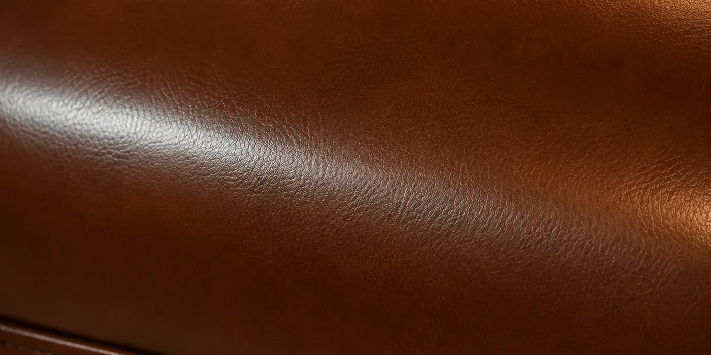 Macro of a recoloured tan leather booth cushion with an even closed surface