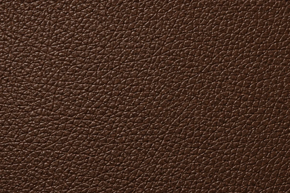 A fine, even pebble grain freshly pressed into a levelled hide, every pore the same size and depth