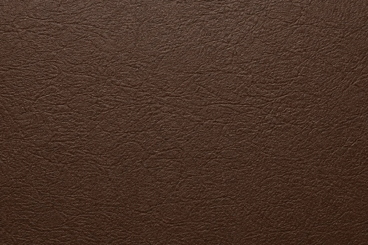 A levelled hide surface, matte and closed, with the natural grain gone and the filler taken smooth