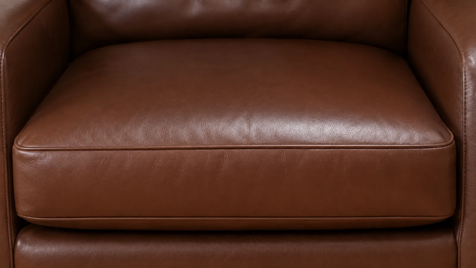 A new corrected grain leather seat cushion with even colour and an intact finish