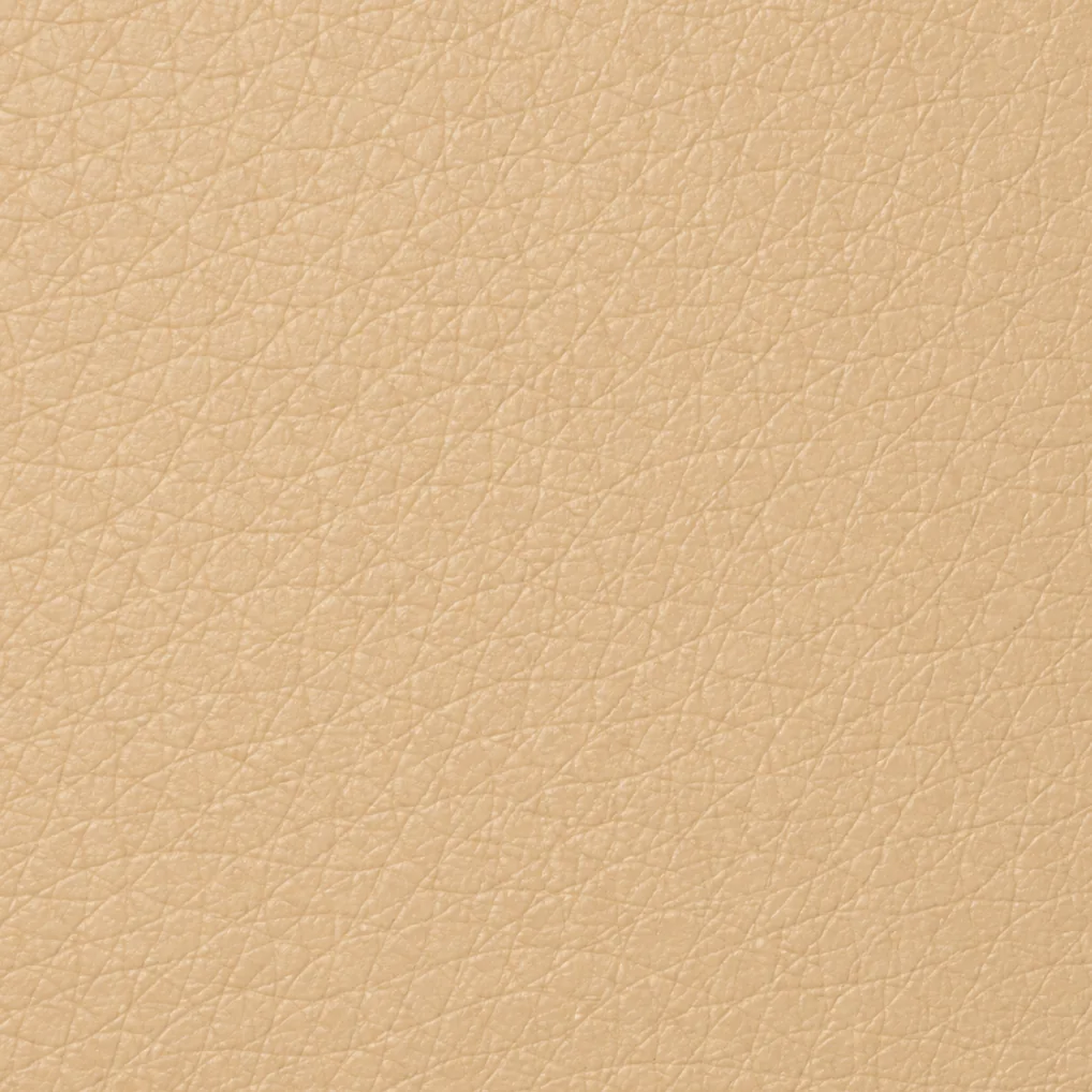 A sand-coloured PU faux leather swatch with the fine embossed grain of a polyurethane coating
