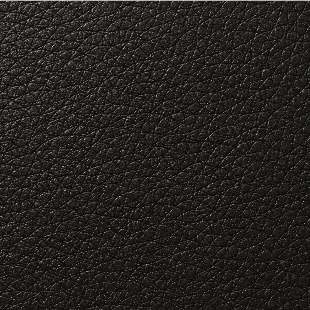 A charcoal faux leather swatch, the coated textile sold under the name vegan leather