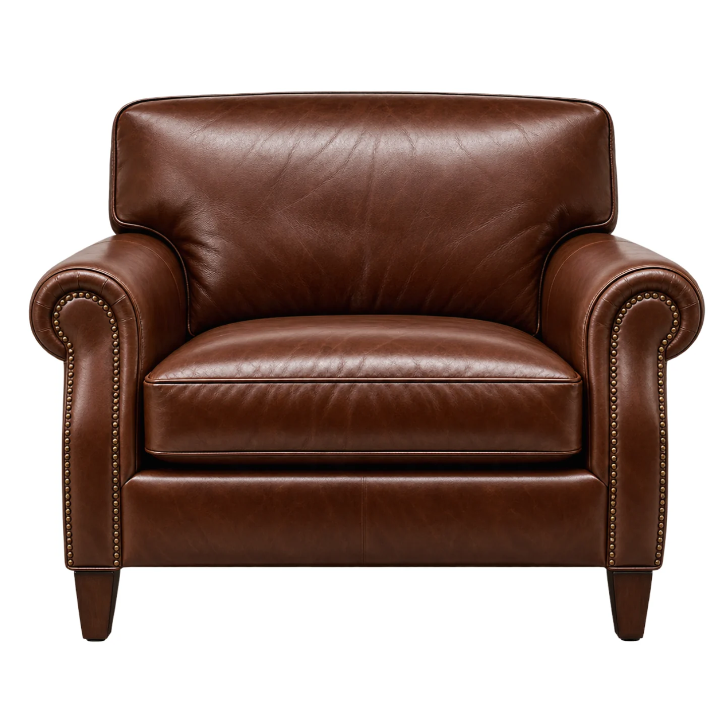 The same armchair after regular use: the leather has softened and the first creases have set into the seat and arms.