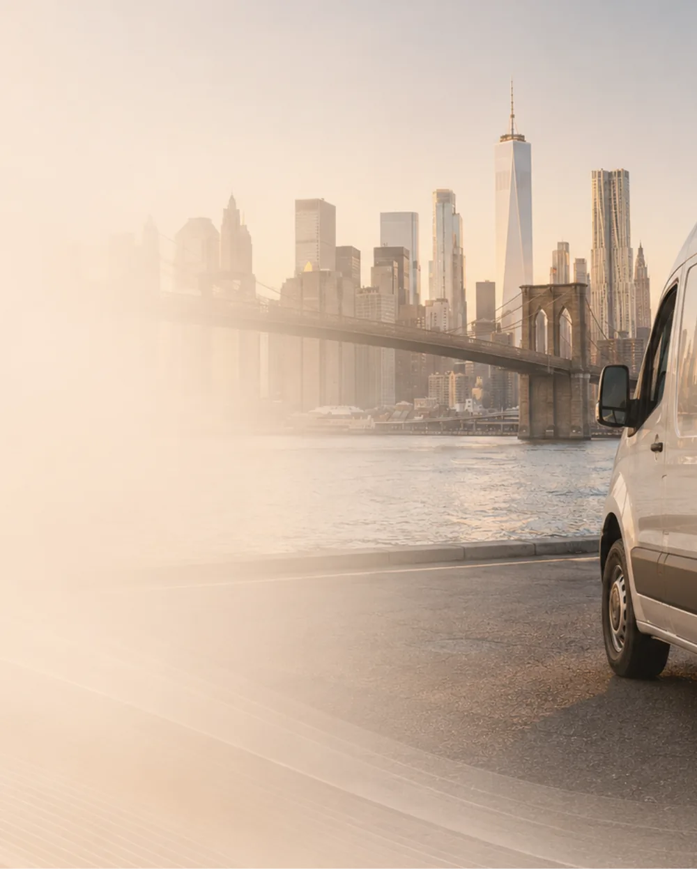 A furniture pickup and delivery van on the approach to Manhattan with the New York City skyline behind it