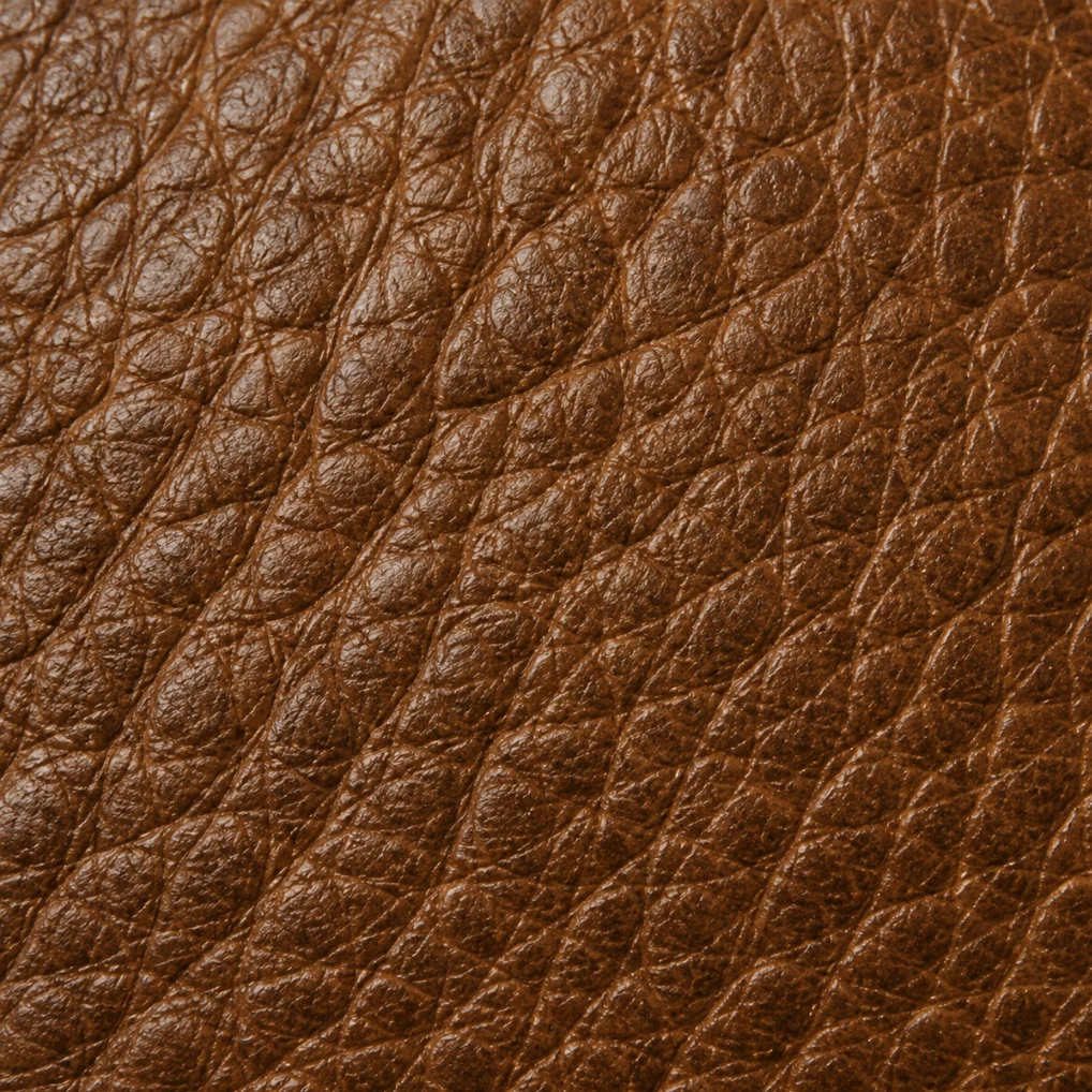 Close-up of aniline leather, open pores and tonal variation with no surface coating over the hide