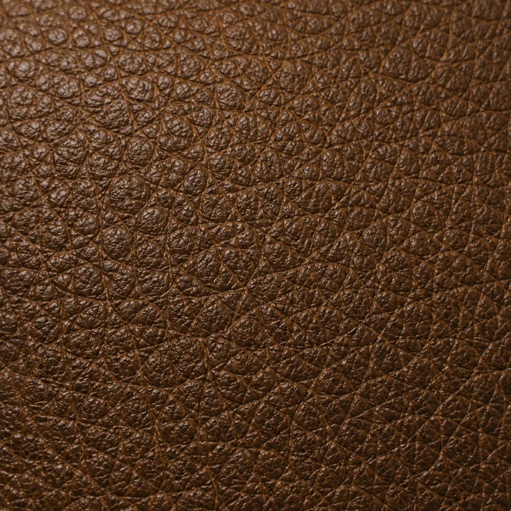 Close-up of semi-aniline leather, natural grain still visible through a light protective finish