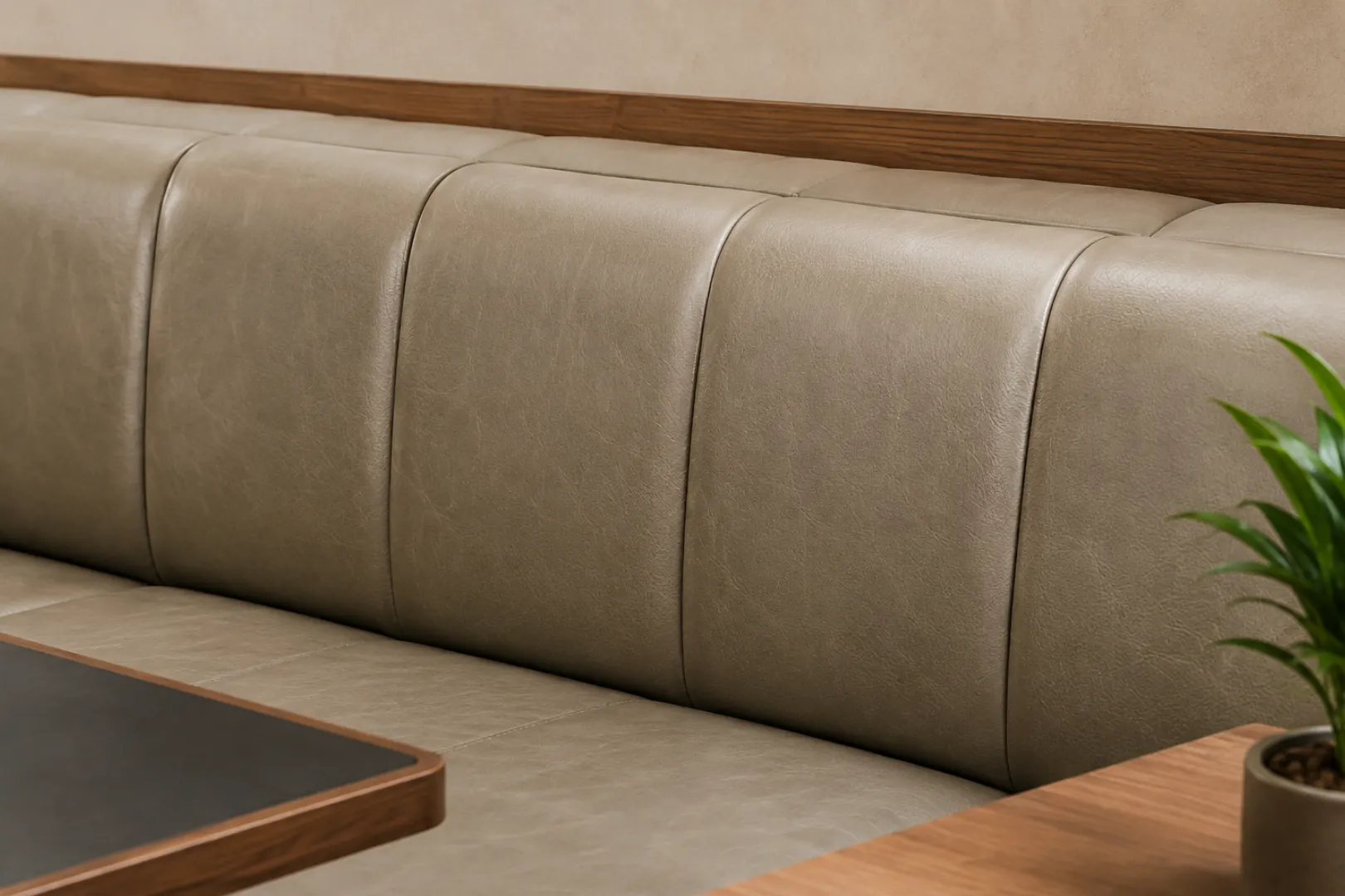 Grey leather lobby bench in commercial use, rated for abrasion and cleaning