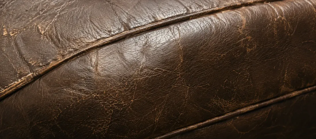 Crazed topcoat on dark brown bar seating during bar furniture restoration NYC
