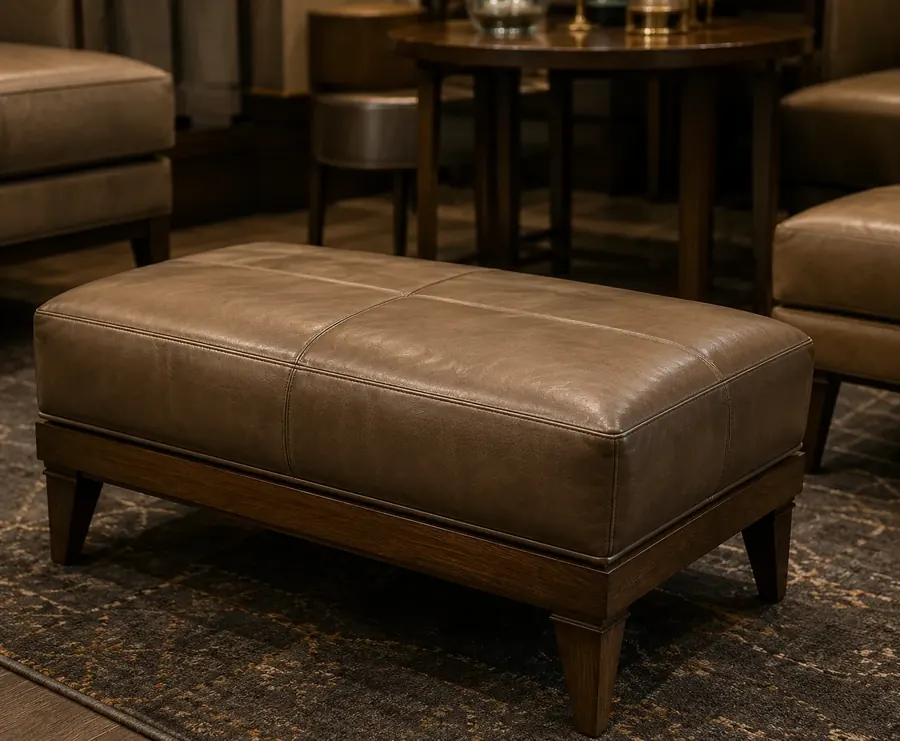 Large brown leather ottoman bench on turned wood legs