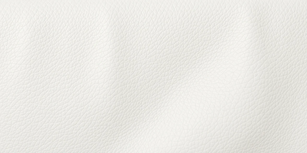 Soft ivory leather surface with gentle natural creases, refinished rather than replaced