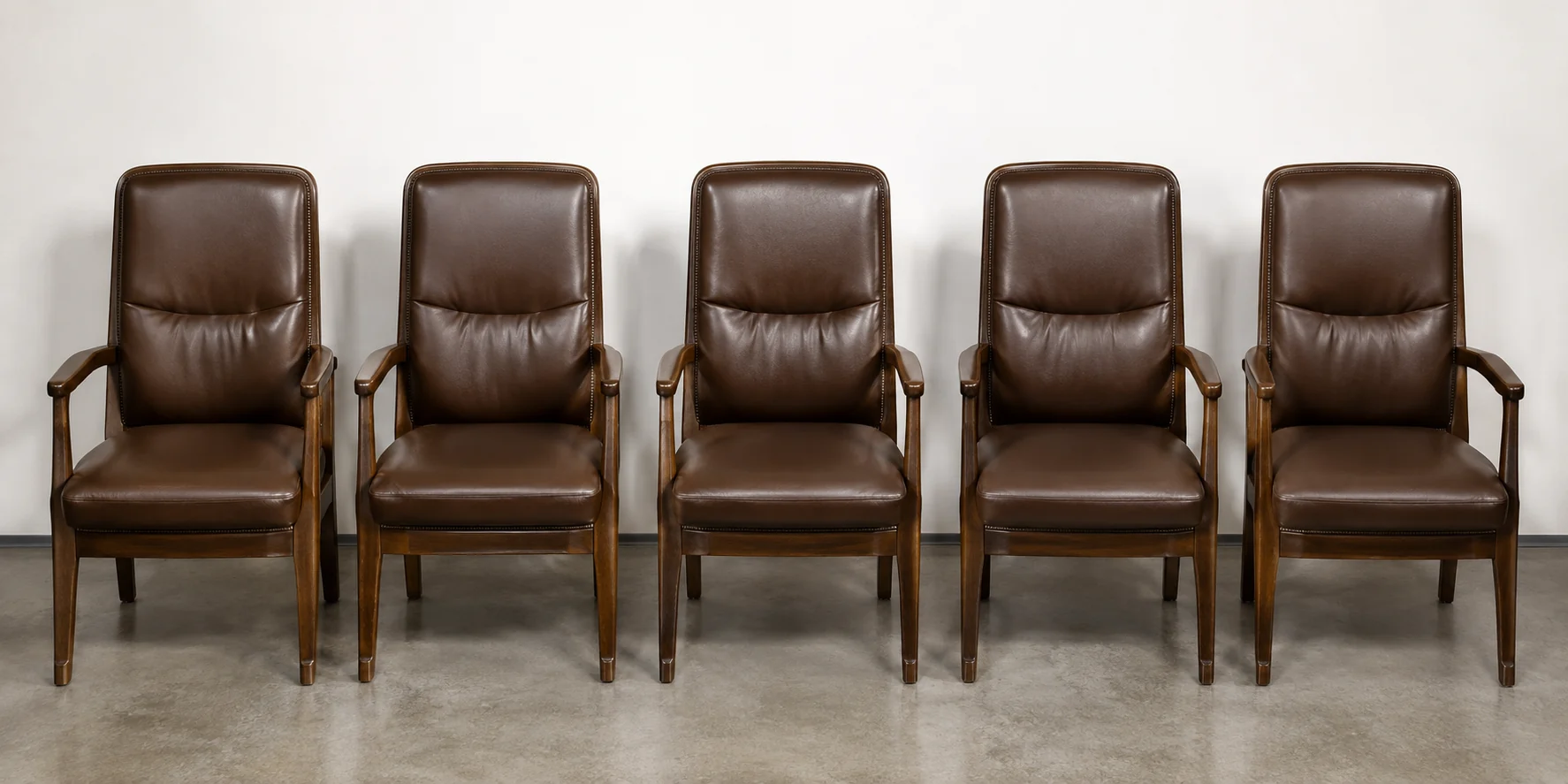 The same row of law office chairs after the repaired seat was colour matched