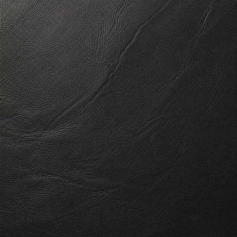 Close view of black commercial grade vinyl with a soft natural grain