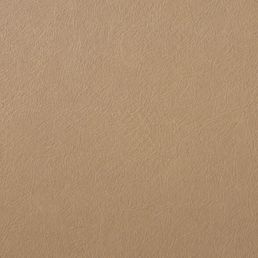 A flat tan leather swatch in the shade the furniture shipped in