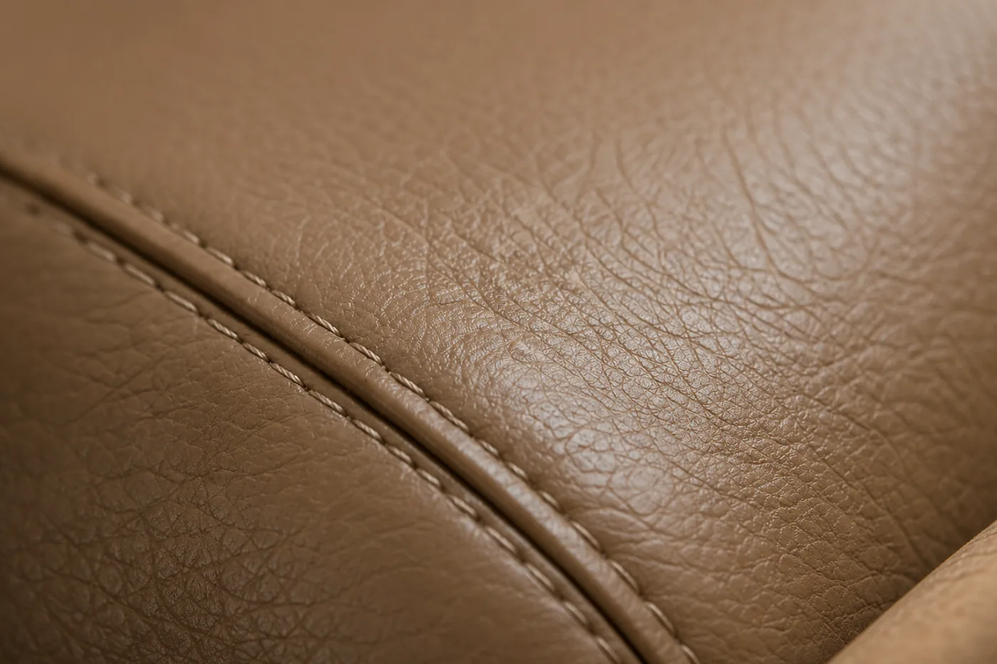 Clear topcoat being sealed over restored leather color