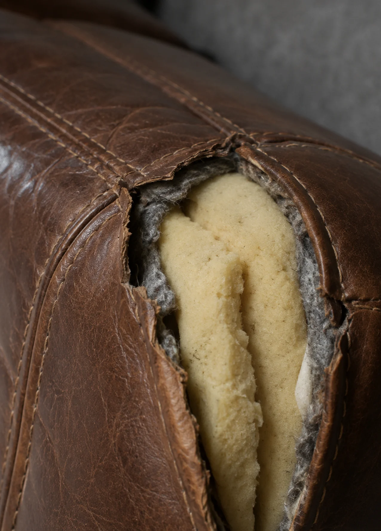 Hotel sofa seat torn through to the foam, cover and filling both failed