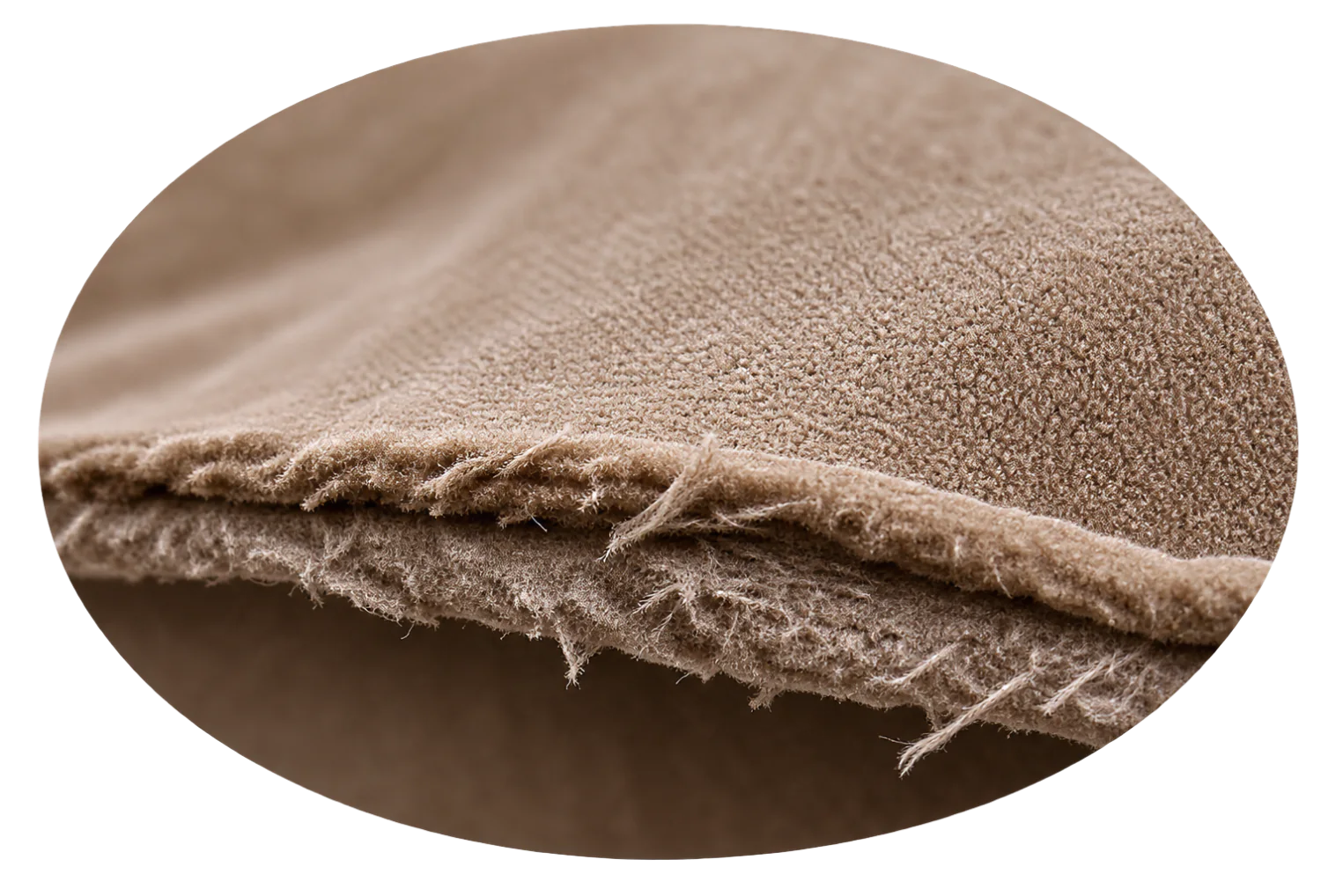 Cut edge of a microsuede panel: a woven scrim backing visible under the pile, already fraying into loose threads