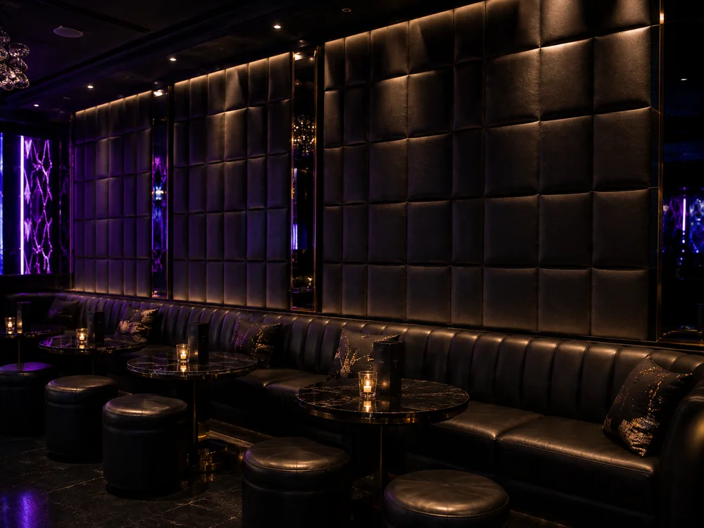Upholstered leather wall panels in a venue, each one a separate replaceable section
