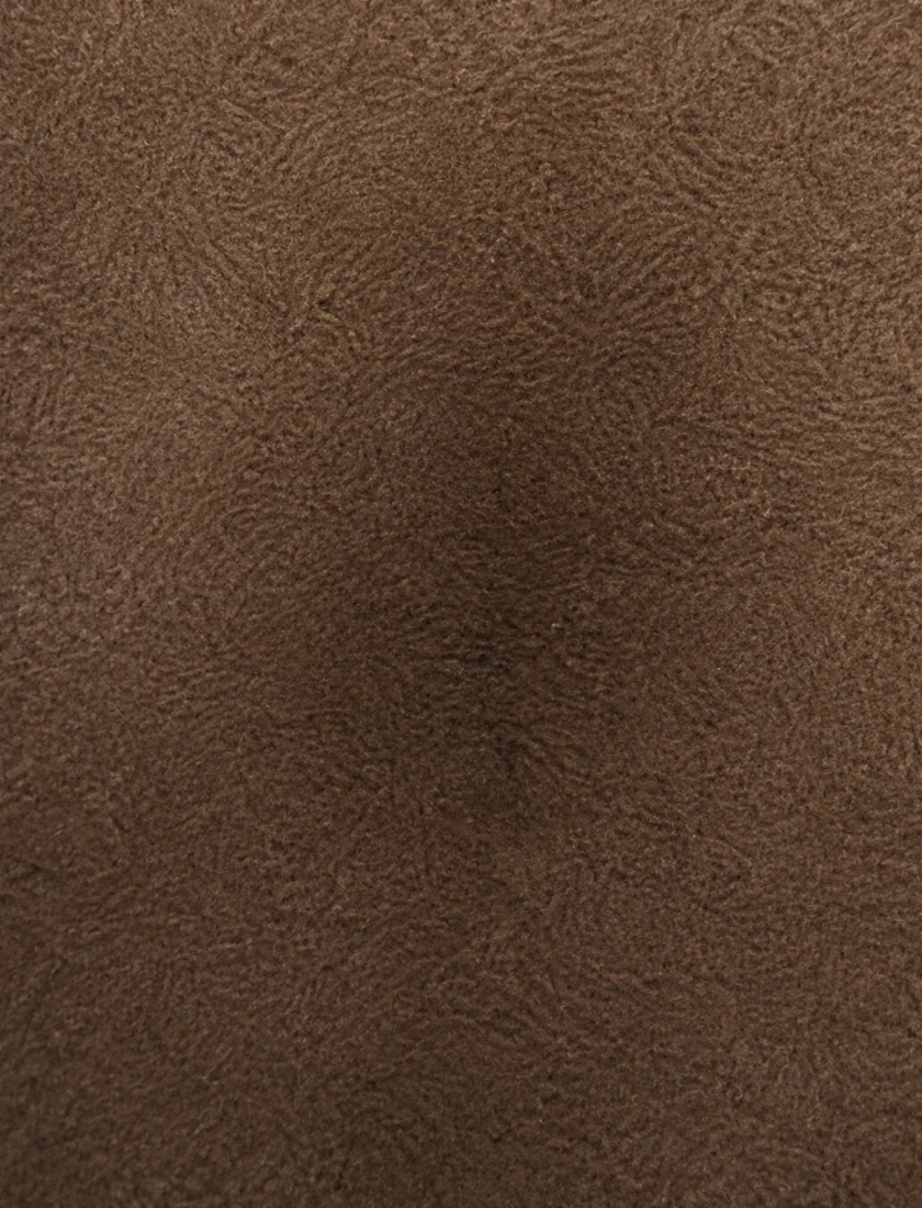 A darker area of nubuck caused by oil contamination, which stays dark when the nap is brushed