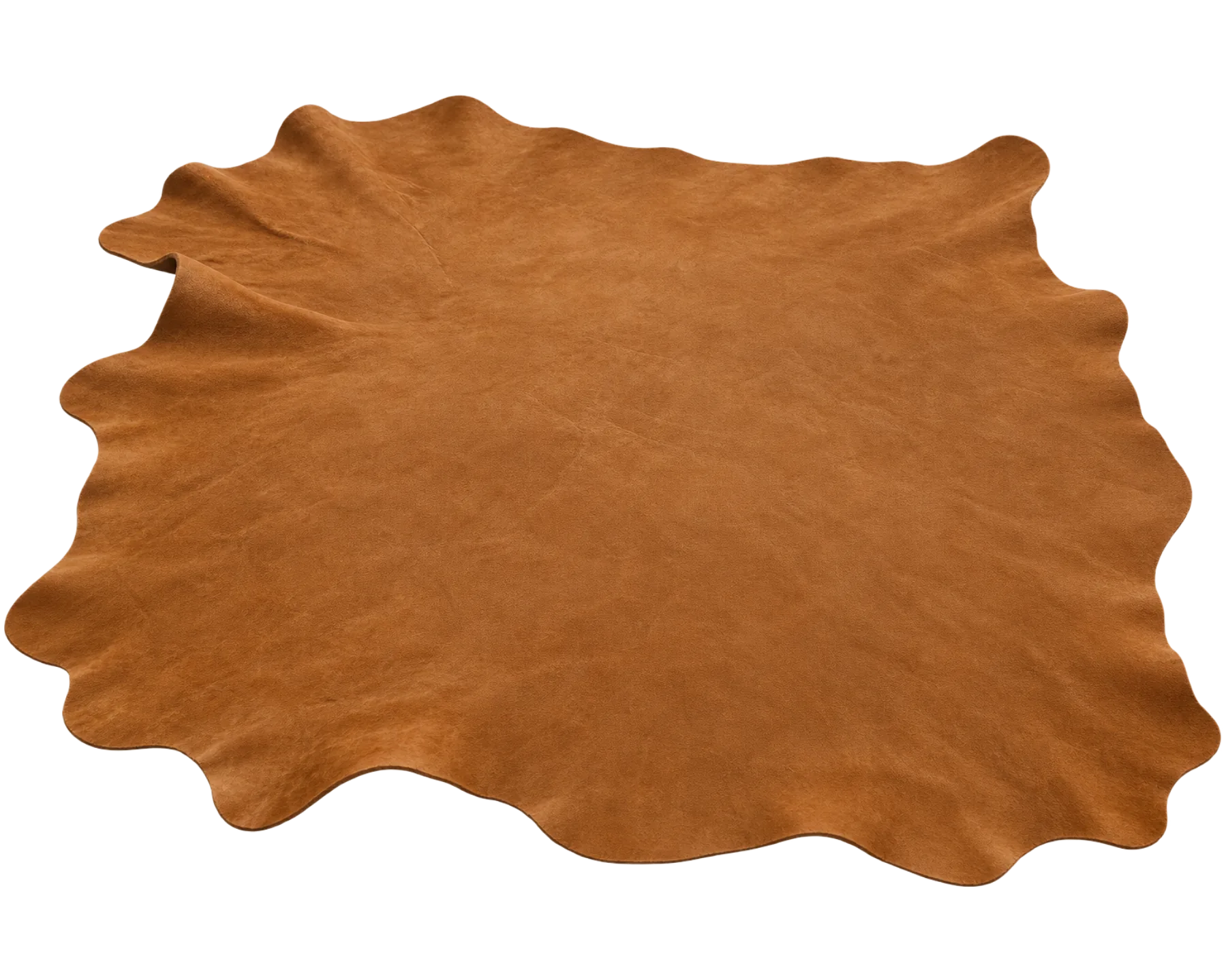 A full nubuck hide laid flat, showing the natural irregular outline of the animal
