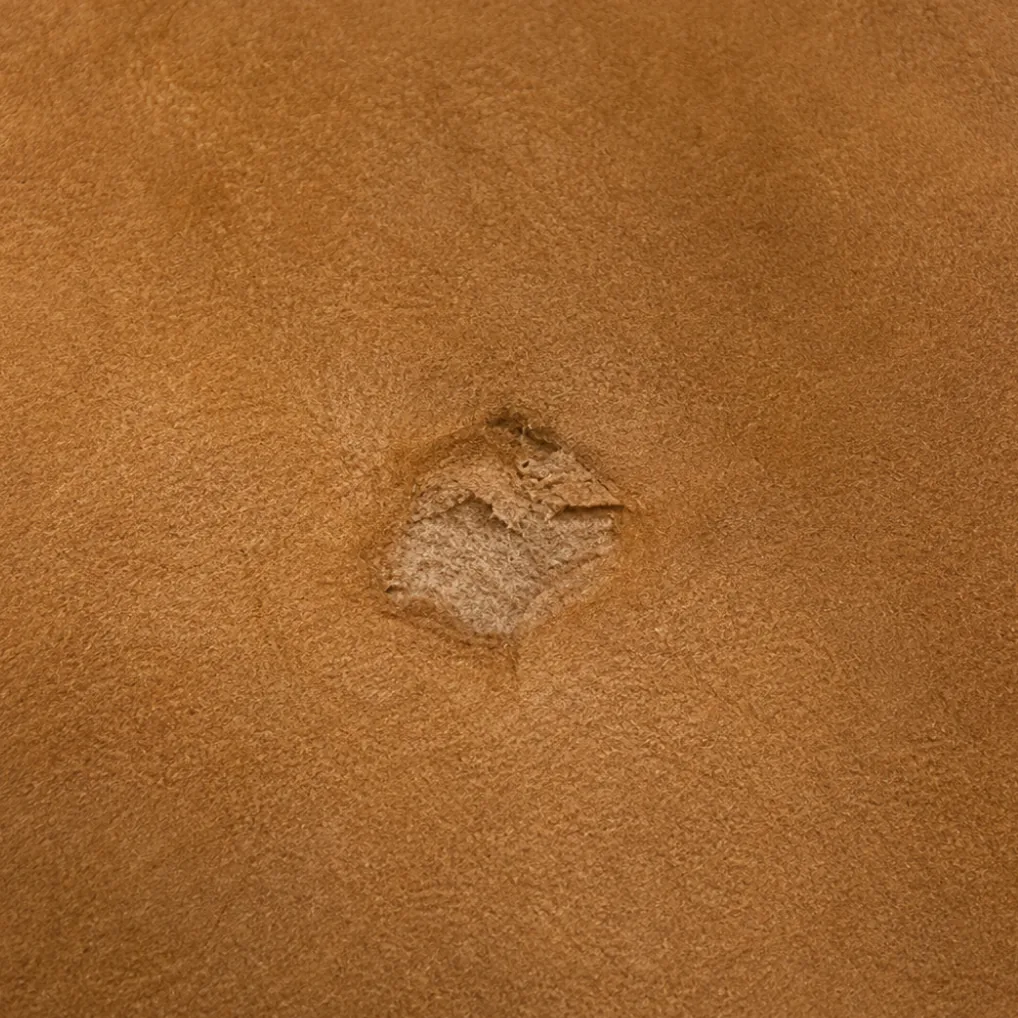 A healed scar in the surface of a nubuck hide