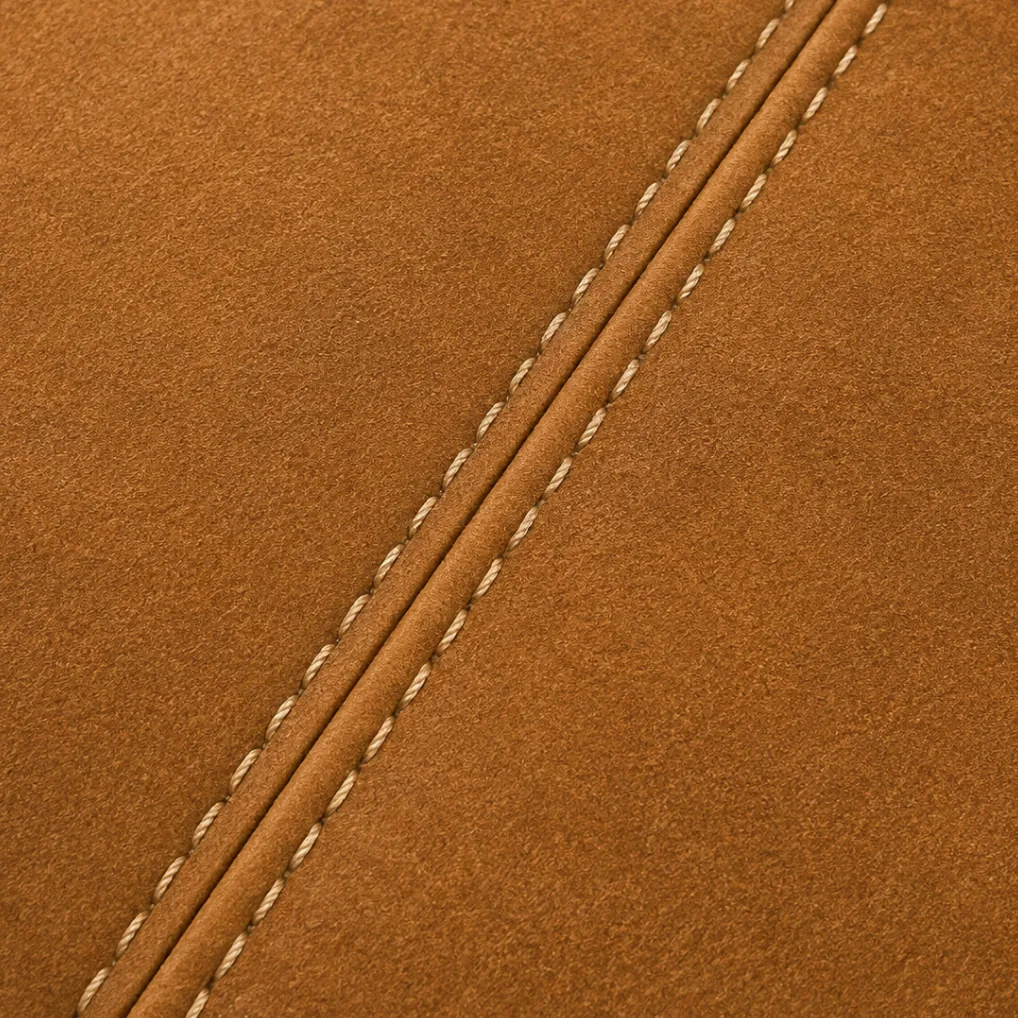 A stitched seam running diagonally across two joined nubuck panels
