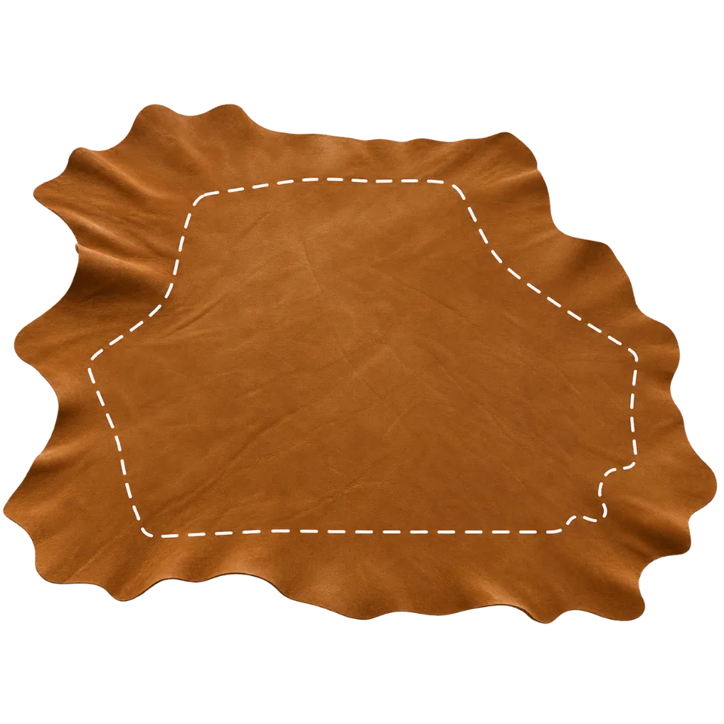 A nubuck hide with a dashed line marking the usable rectangle inside its irregular outline