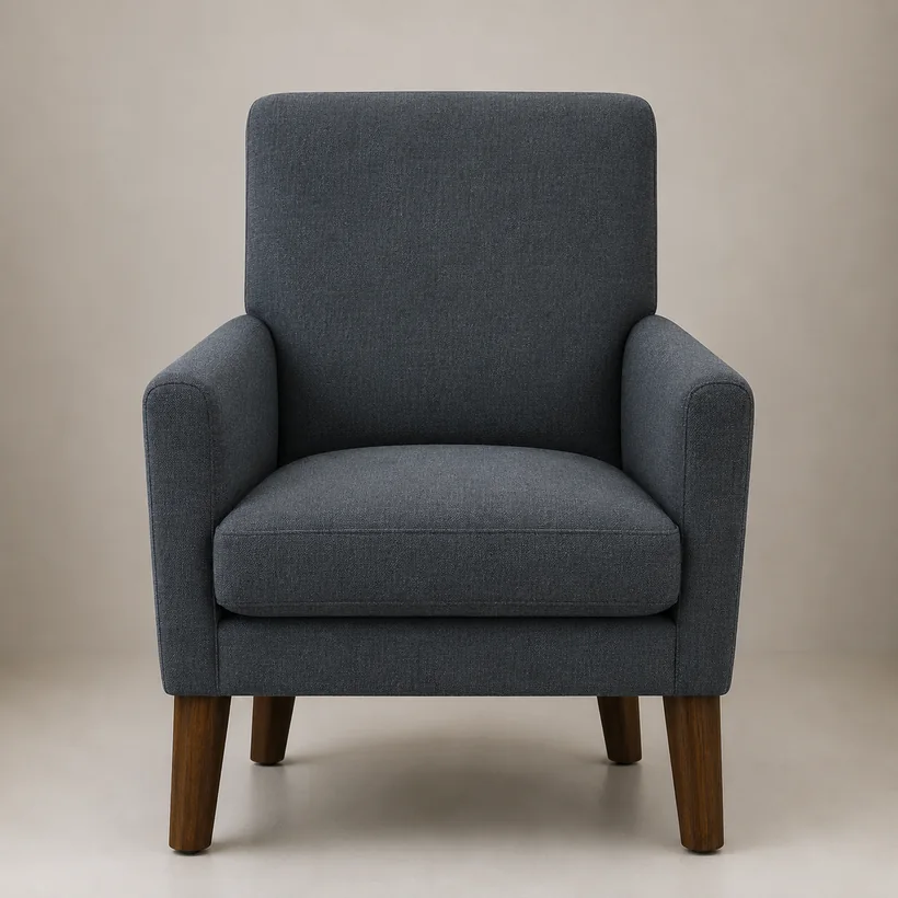 The same armchair covered in a navy solution-dyed performance fabric