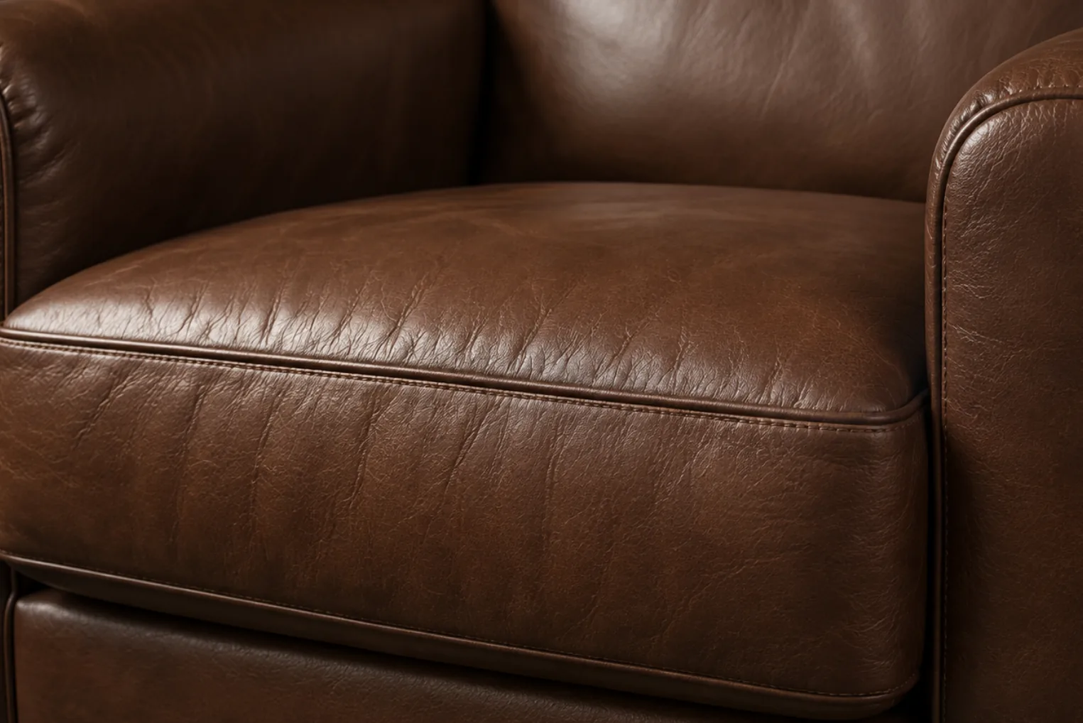 A brown PVC vinyl armchair seat holding a firm, flat shape