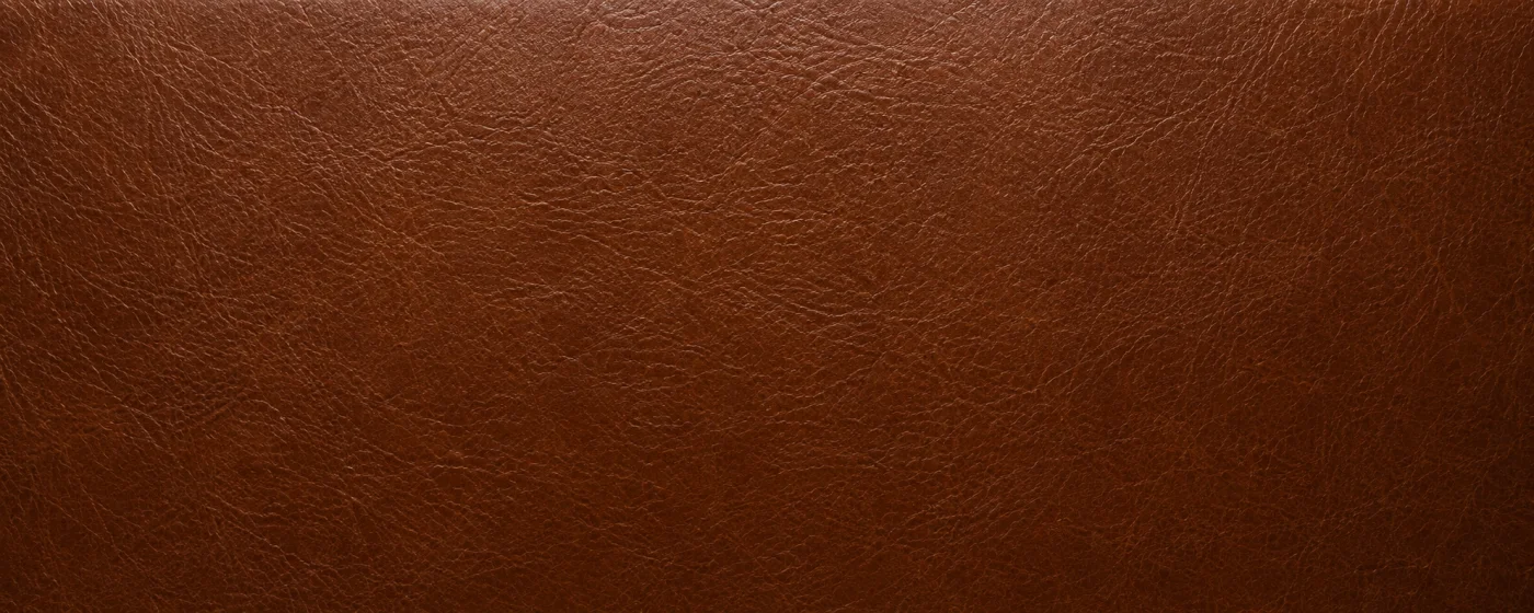 Brown pigmented leather upholstery swatch of the kind used on restaurant booths and dining chairs