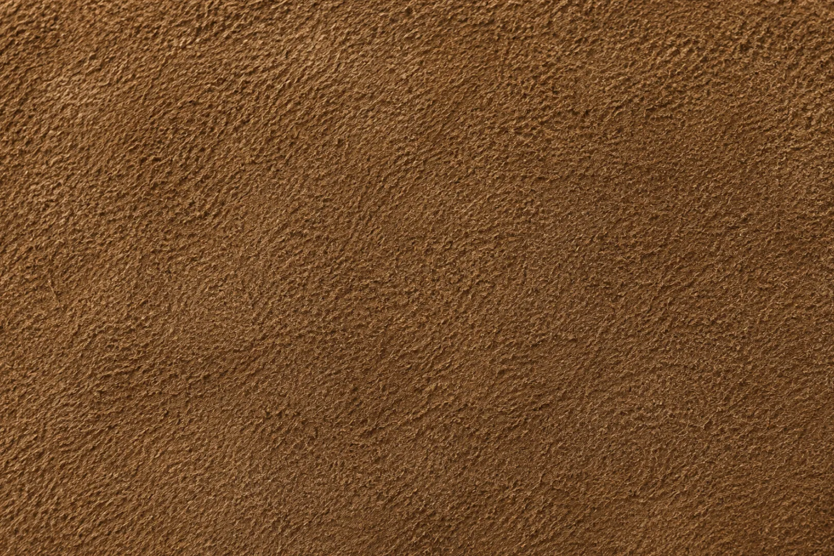 Split leather surface, fibrous and napped with no grain pattern of its own