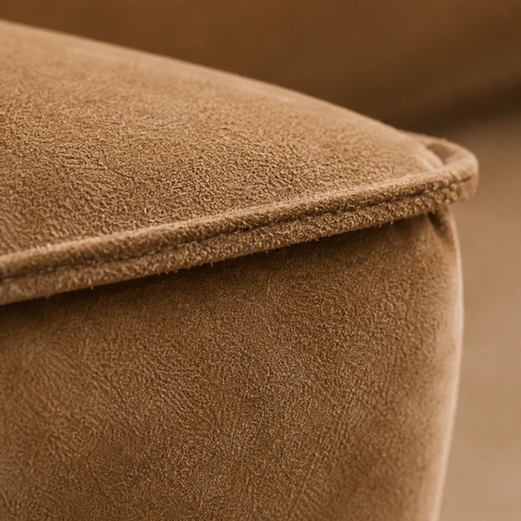 Macro of a piped suede cushion edge, the raised fibre still standing along the welt