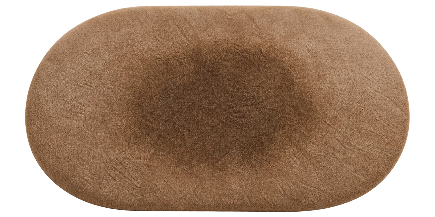 Water absorbed straight into suede, leaving a soft dark patch with no drop left on the surface