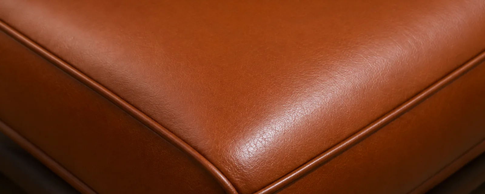 The same tan cushion after the finish was stripped back and rebuilt, the colour even again