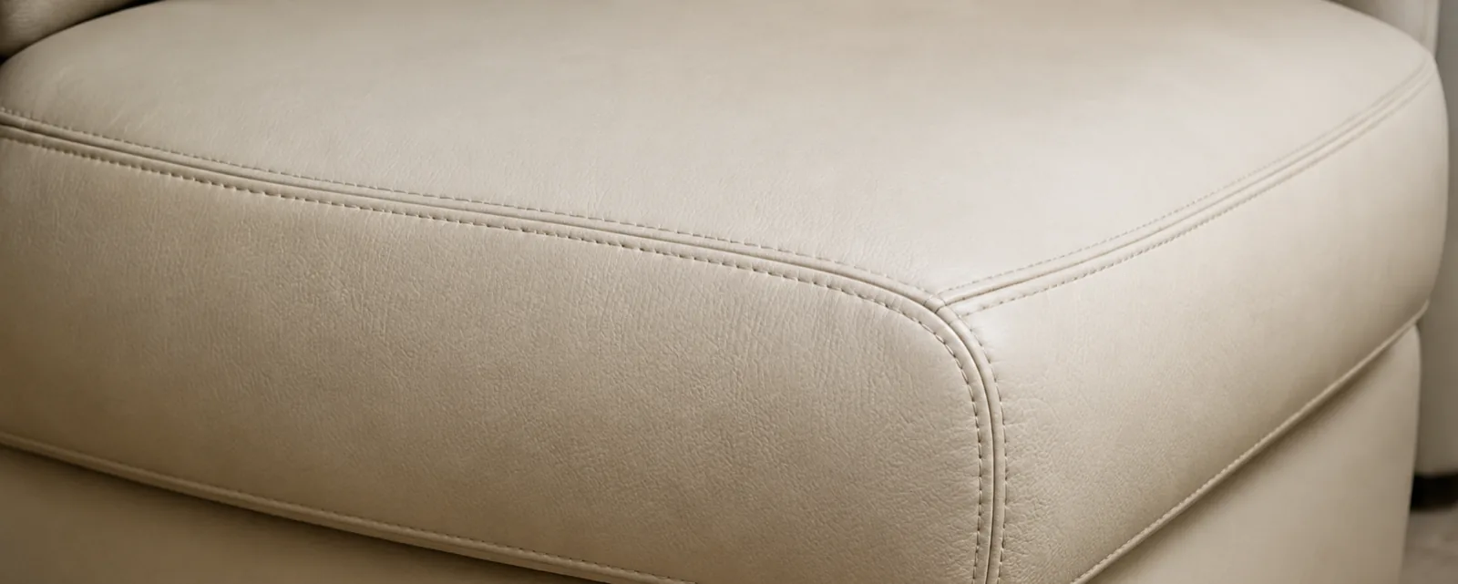The same cream leather cushion with the ink gone and the colour matched back