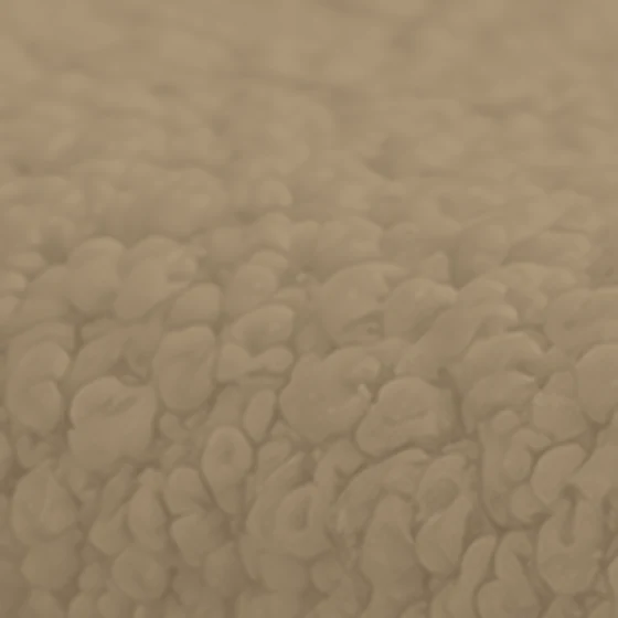 Bouclé upholstery fabric texture in a mid taupe color
