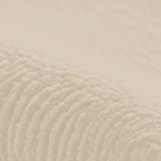 Chenille upholstery fabric texture in a pale sand color