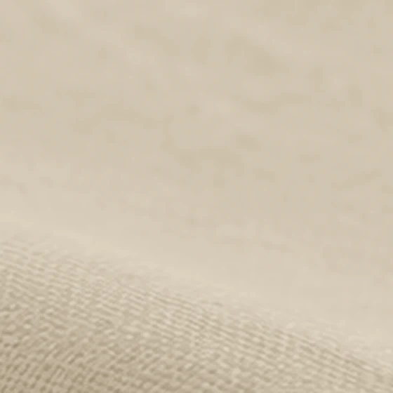 Linen upholstery fabric texture in a pale sand color
