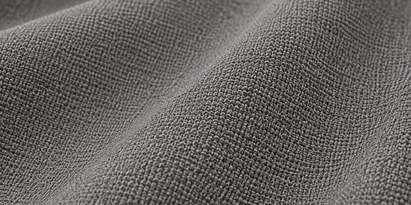 Macro view of grey nylon upholstery fabric showing its dense woven surface