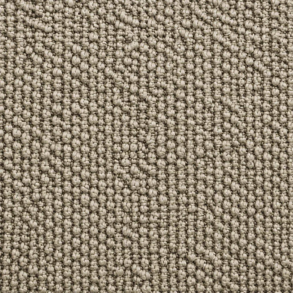 Close-up of a nubby upholstery fabric texture showing individual yarn loops