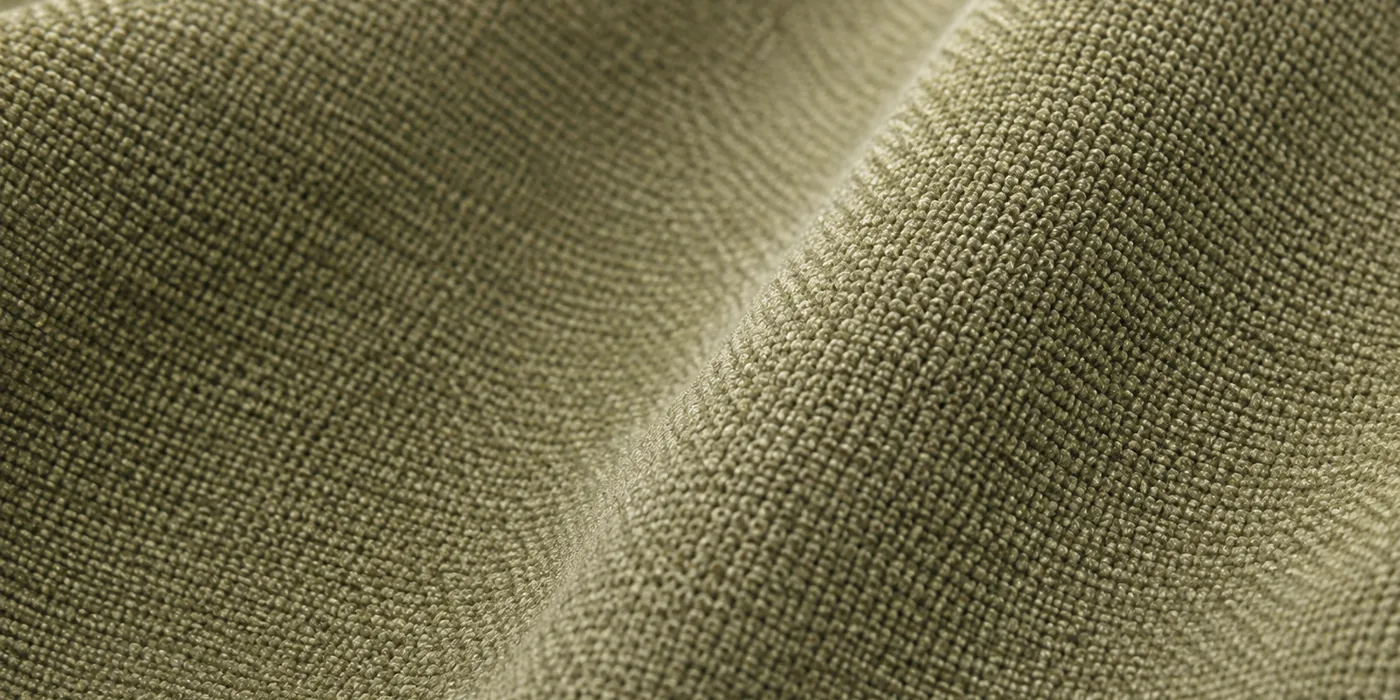 Macro view of olive viscose upholstery fabric catching the light across the weave