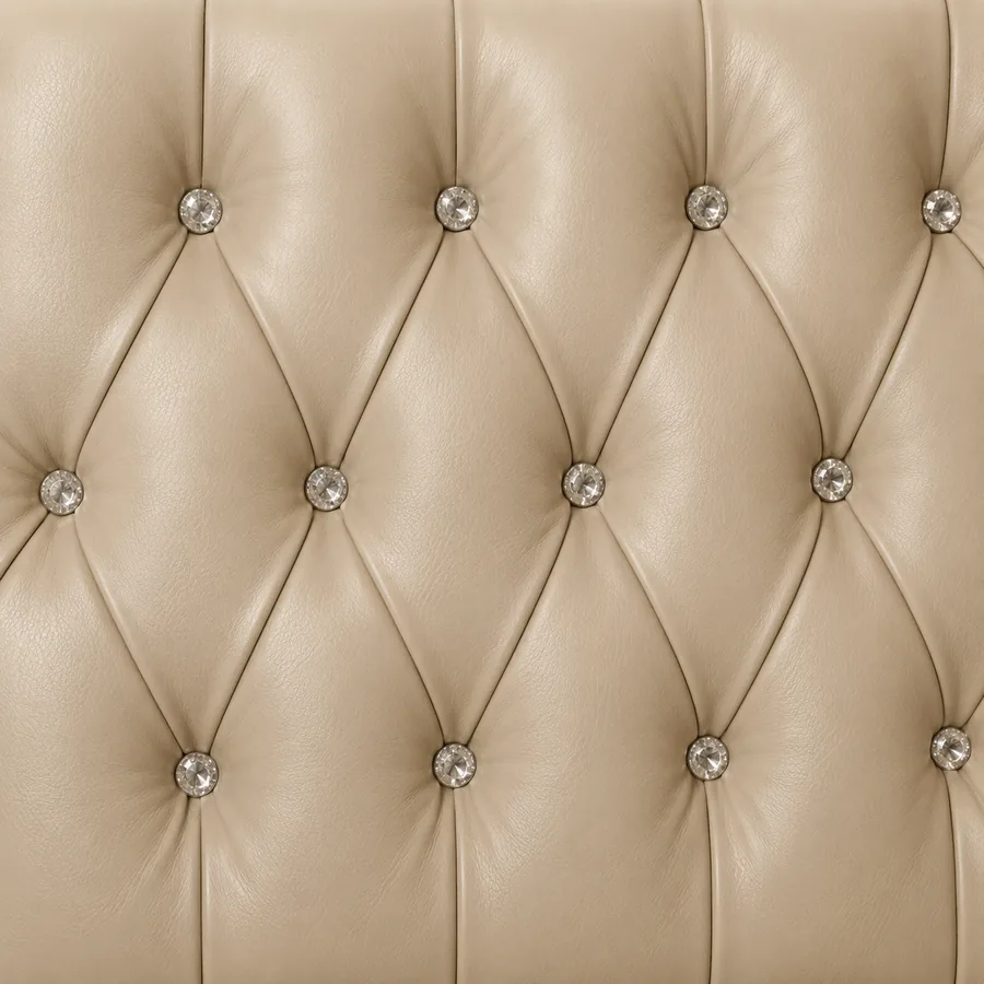 Cream leather tufted on a diamond grid with faceted crystal buttons
