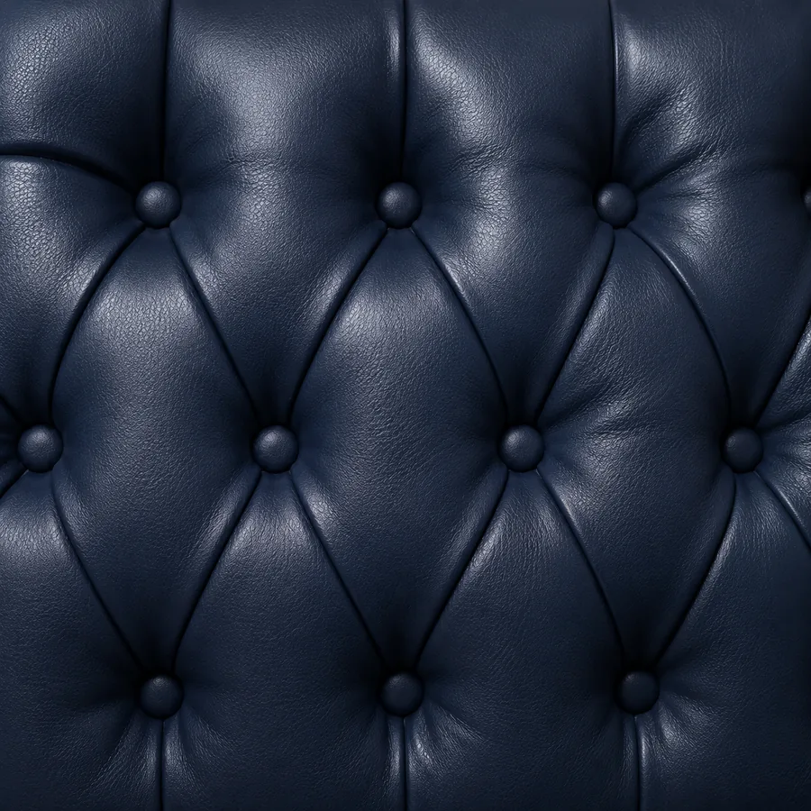Navy leather in deep diamond tufting with self-covered buttons