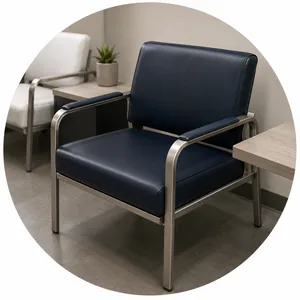 A navy vinyl clinic chair on a chrome frame beside a small side table