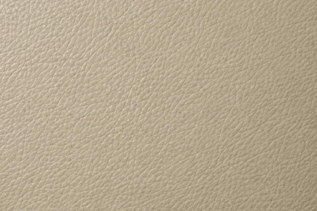 Commercial vinyl swatch — tan wipe-clean upholstery vinyl for bar banquettes