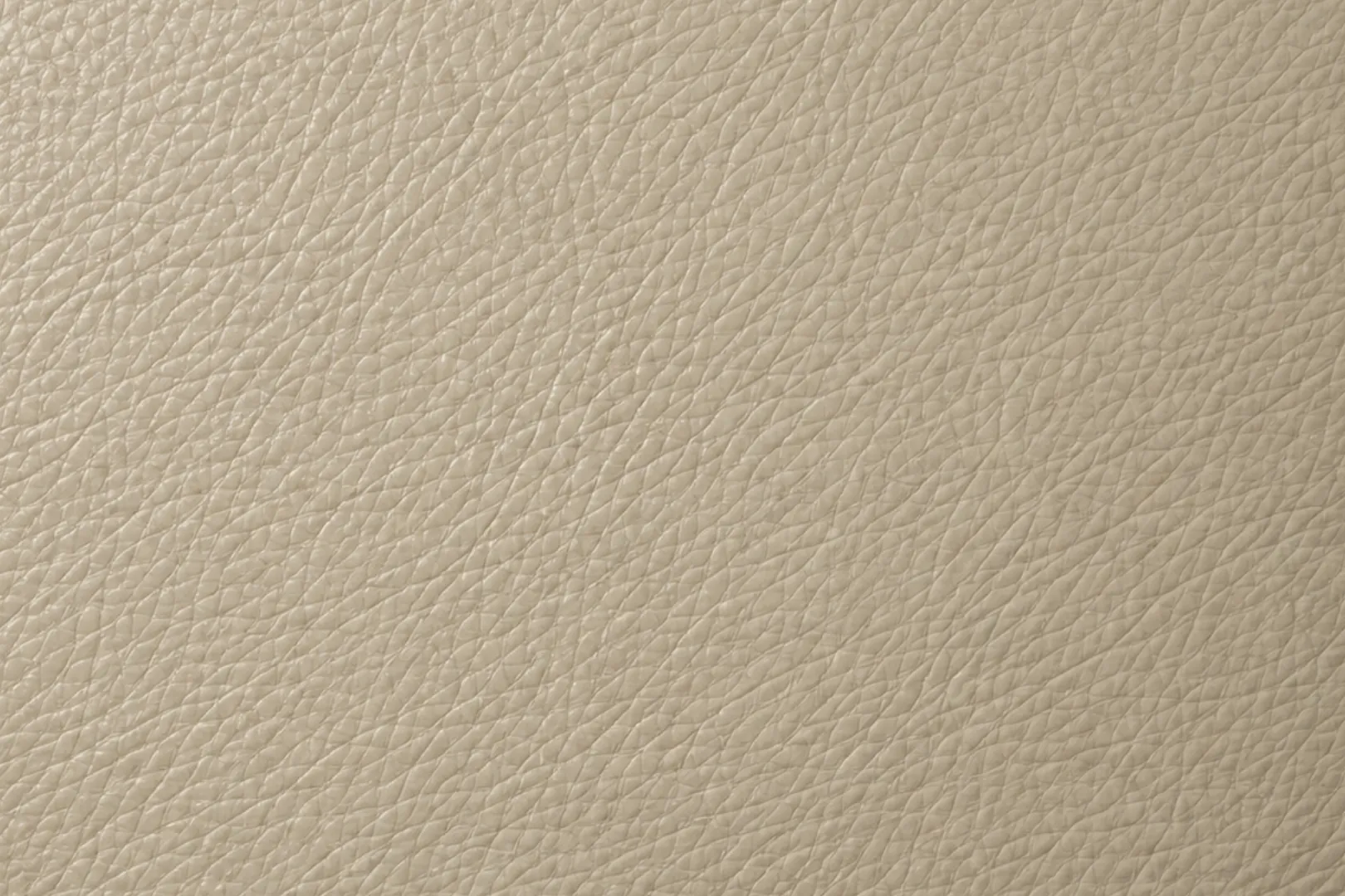 Close view of pale greige upholstery vinyl with a fine even grain