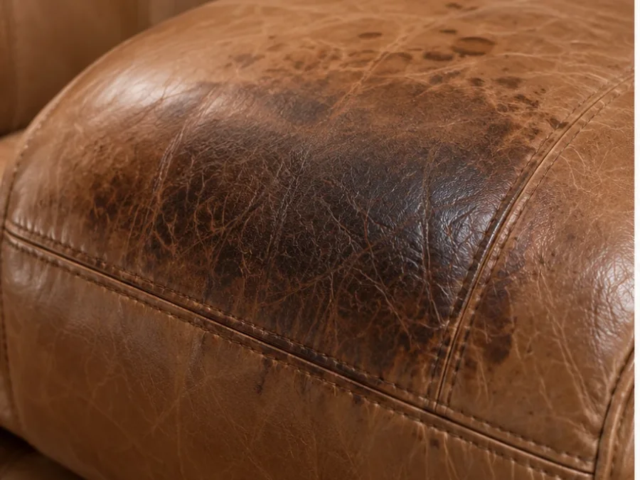Aniline leather seat shaded unevenly by years of handling and body oil