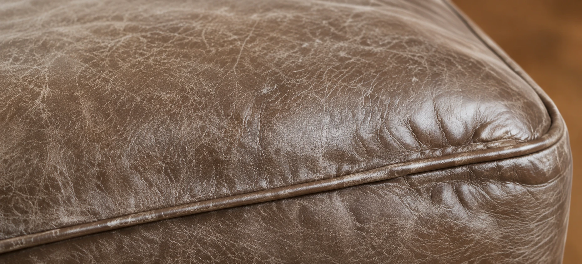 A washed-out taupe cushion corner where the colour has gone flat