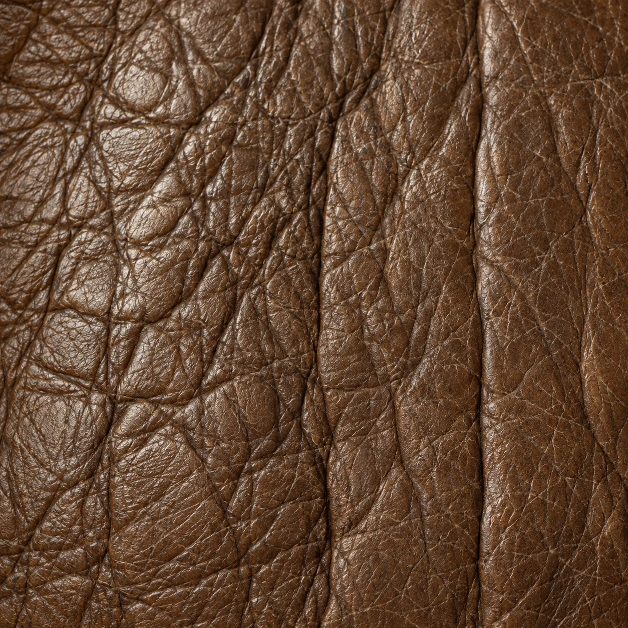 Close grain of a waxed brown upholstery hide